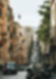 photo-of-cars-driving-on-road-between-bu