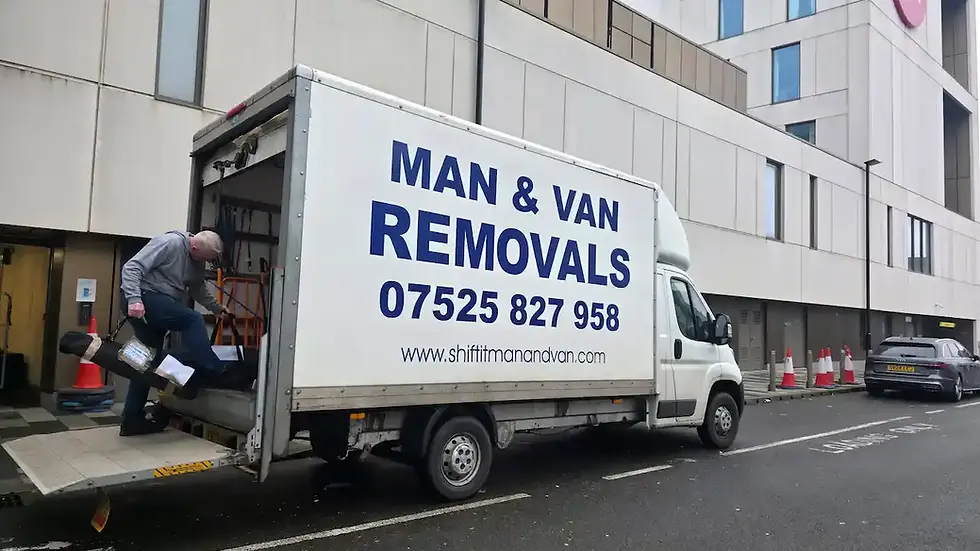 Wide angle view of a removal van parked outside a typical UK suburban house