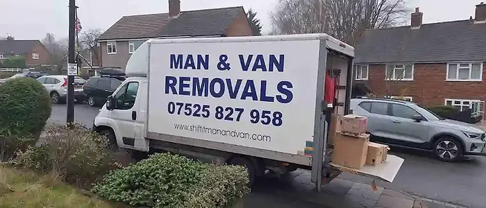Professional movers loading a van for a Birmingham house move