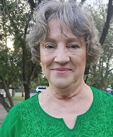 Smiling lady in green top