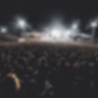 A large audience at a nightime rock concert.jpg