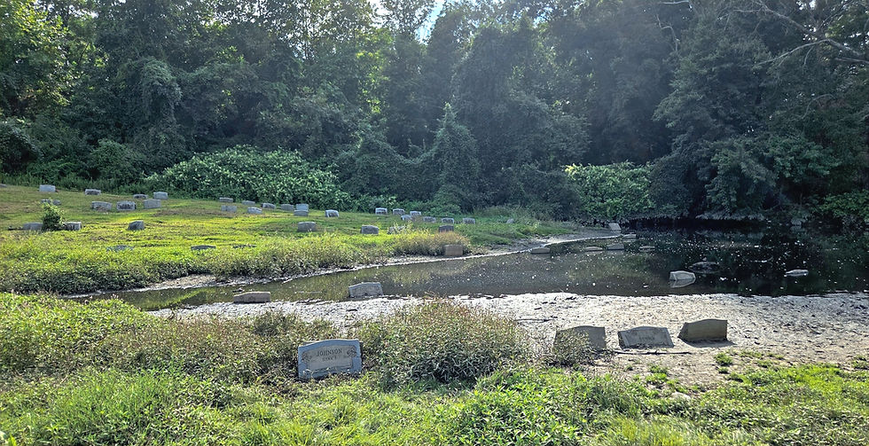 flooded cemetery with headstones peeking out of the water some fully submerged surrounded by