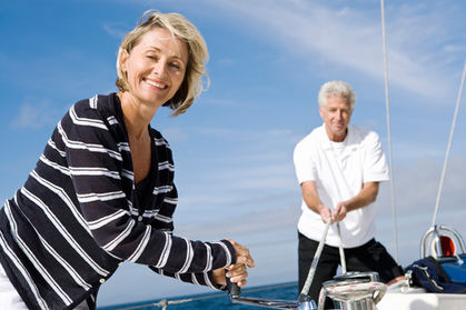 Happy couple boating in Santorini