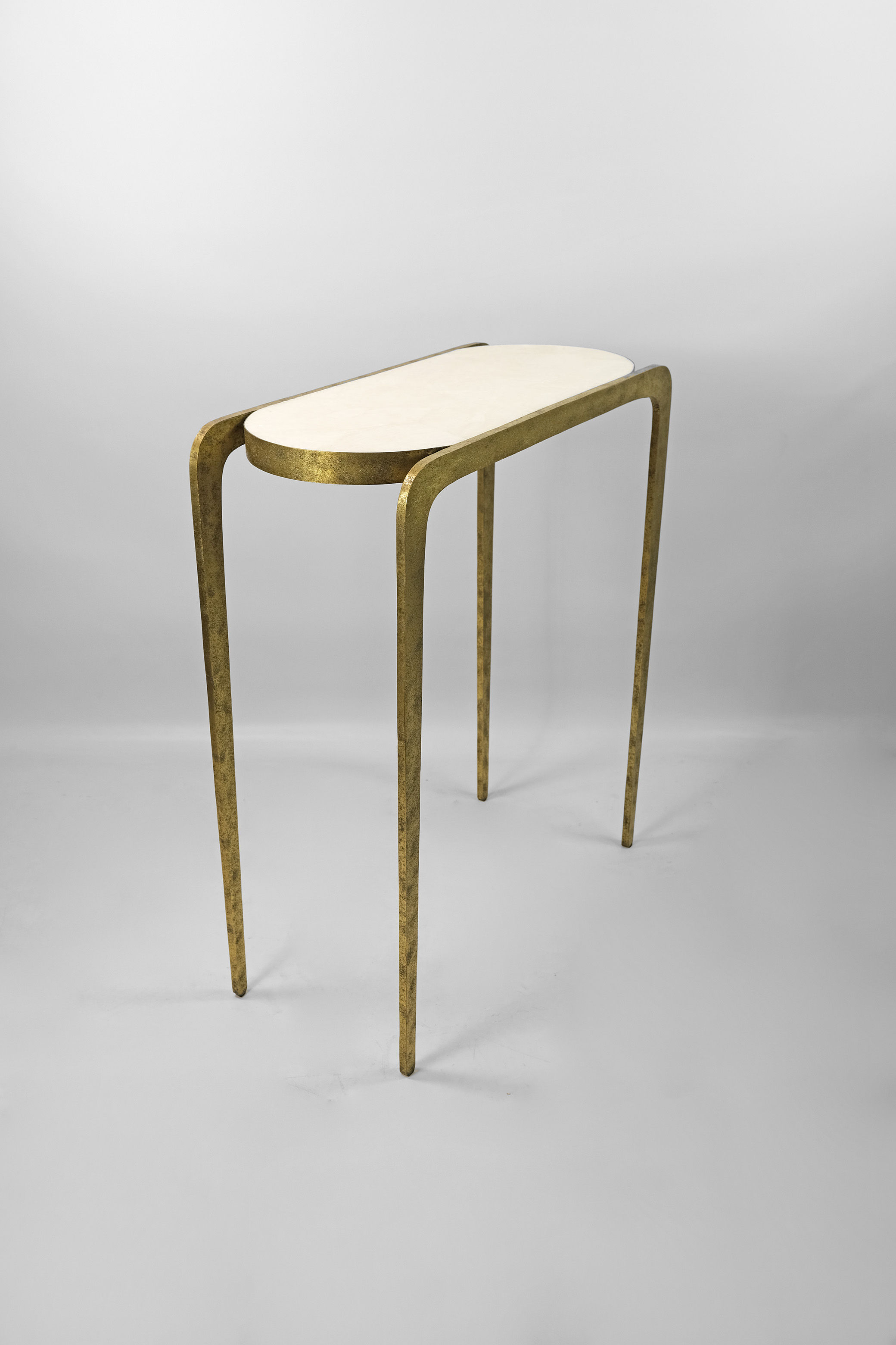 console table in brass with a rock crystal top