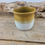 Miniature : Petite tasse cintré sans anse, grès émaillé ocre et blanc mat