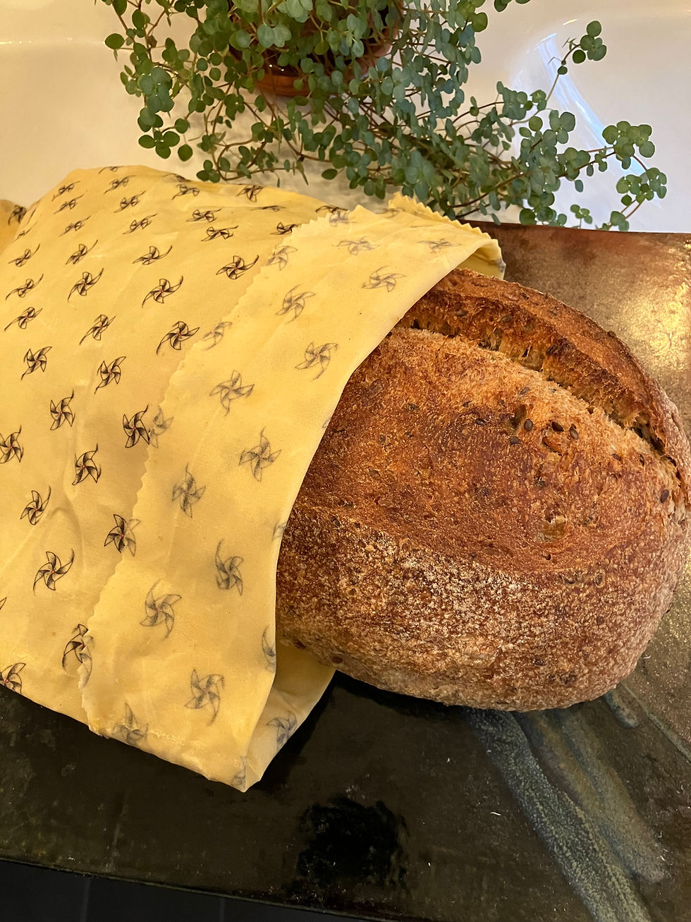 Beeswax Bread Bag with a sourdough loaf partially inside