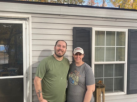 Couple in front of a house