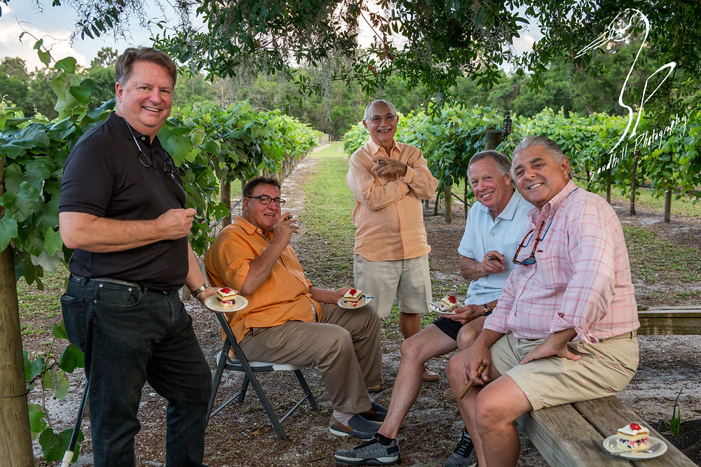 Fiorelli Winery & Vineyard wine 'n dine Bradenton guests smiling cigars desert