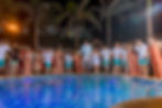Sarasota Wedding Photographer Wedding Party jumps into the pool after the reception