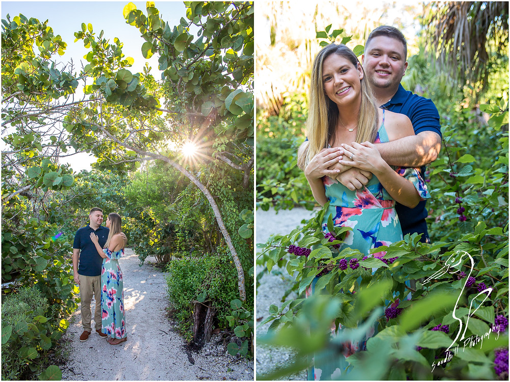 DeSoto National Memorial Photography, an engaged couple embrace on a path through the woods as the sun shines through, Sandhill Photography Bradenton