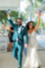 Longboat Key Wedding Photographer, newlyweds enter their wedding reception with bubble guns