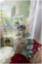 detail of the bride and grooms wedding rings posed ontop of the bridal bouquette.