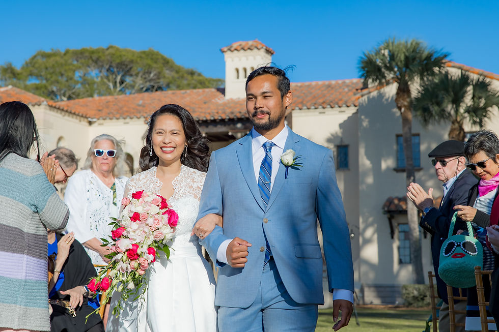 Powel Crosley Wedding Photographer bride smiles as she walks down the aisle to her wedding ceremony on Sarasota Bay