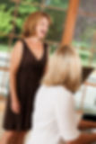 Woman giving voice lessons to a beautiful mature singer.jpg