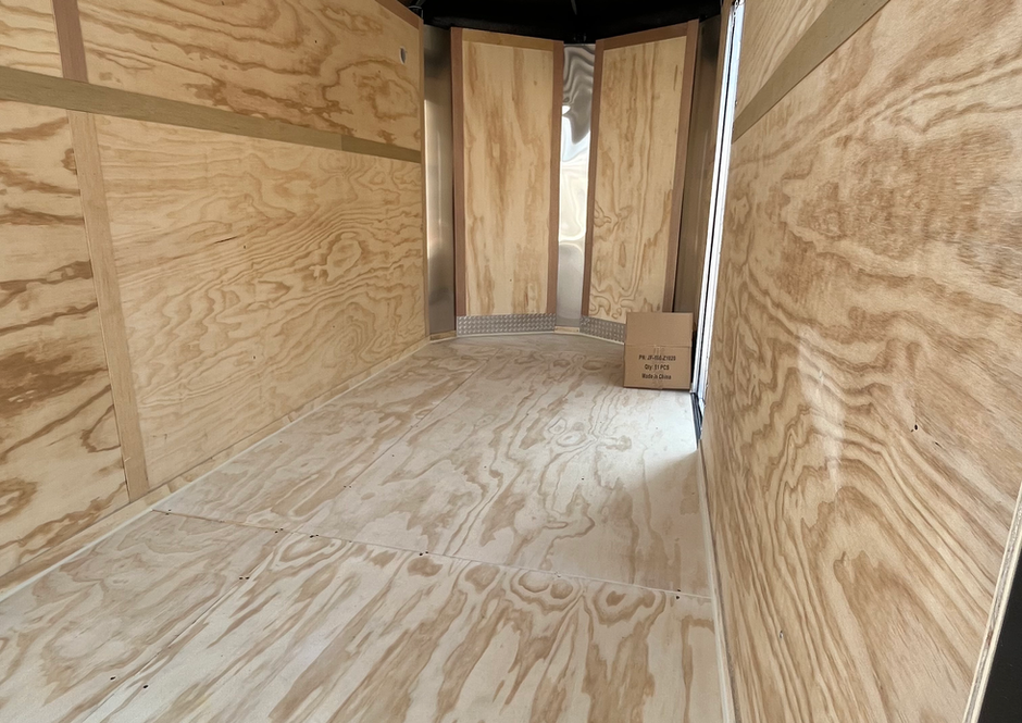 Newly installed wood interior inside enclosed cargo trailer by PNW Trailer Craft in Gresham, Oregon