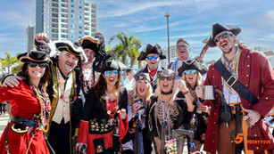 Group of people dressed as pirates, outdoors.
