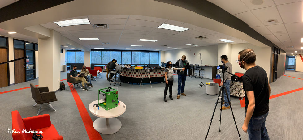 Office space with people and equipment setup.