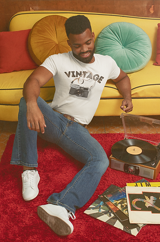 t-shirt-mockup-of-a-man-listening-to-a-record-with-a-70-s-aesthetic-m10519.png