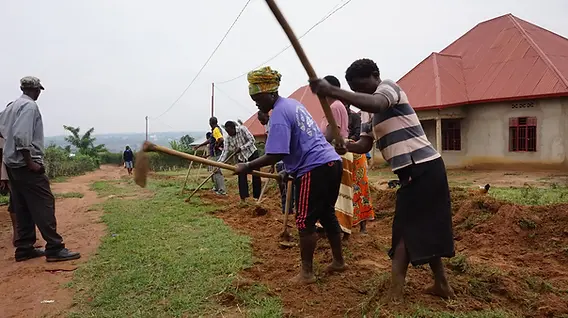 Rwandan community members working together in a village