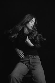 Black and white high school senior portrait girl casual top grey pants Melody Smith Portrait Studio Petersburg VA near Richmond Virginia