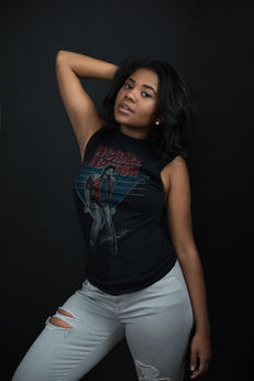 Edgy high school senior portrait girl band tee light jeans dark background Melody Smith Portrait Studio Petersburg VA serving Richmond