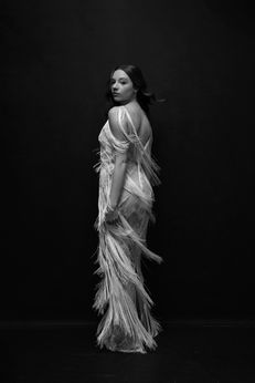 Ethereal high school senior portrait white feather gown dark background Melody Smith Portrait Studio Petersburg VA near Richmond Virginia