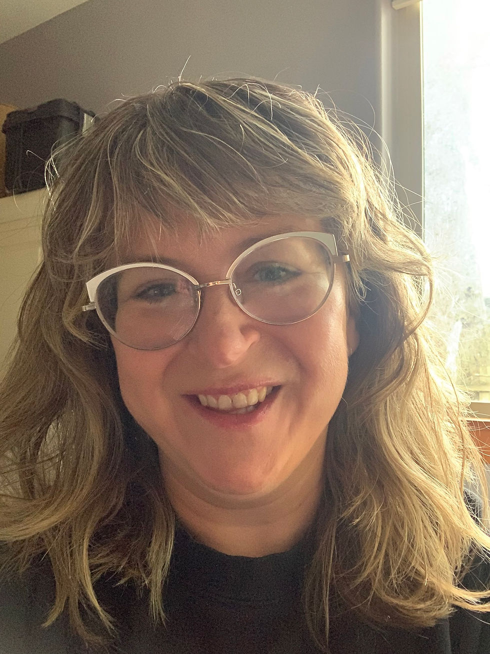 Luke's hair is down in waves. Full smile. Looking at you.