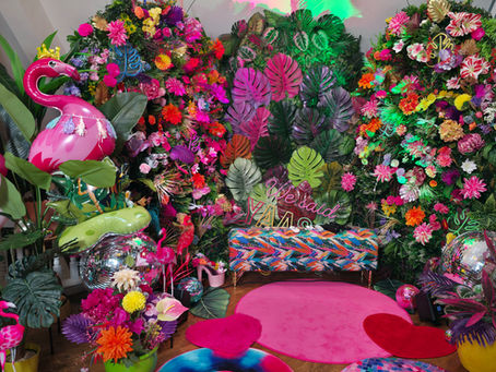 A Jungle inspired backdrop with disco balls and flamingos and lots of colour