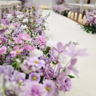 Stunning Purple and Lilac Floral Decor Ceremony setup at Northern Ireland Wedding in Tullyglass hotel