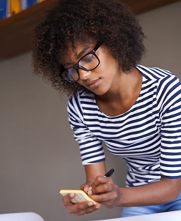 Young Woman Making Notes
