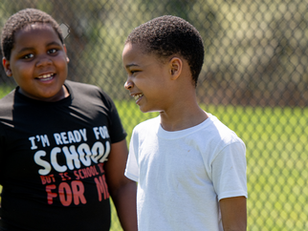 ASUA students socializing outside in the sun.