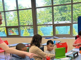 Author Mason Clark teaching in his classroom with his students