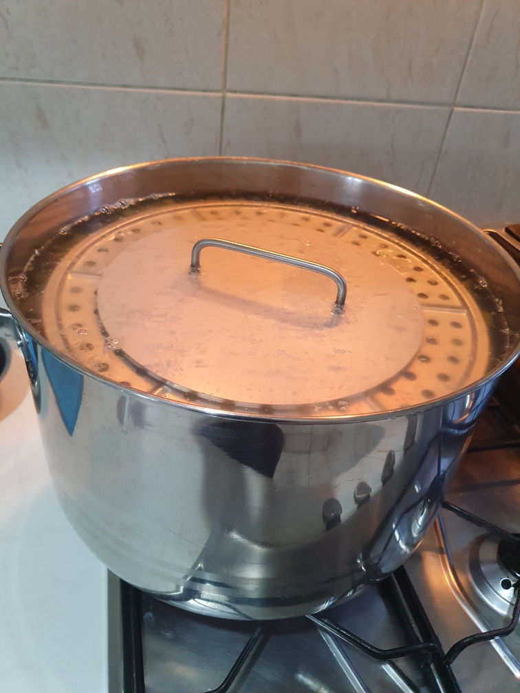 Stainless Weight being used to cooked grape leaves, dolmades, tolma, warak enab, and other stuffed dishes.