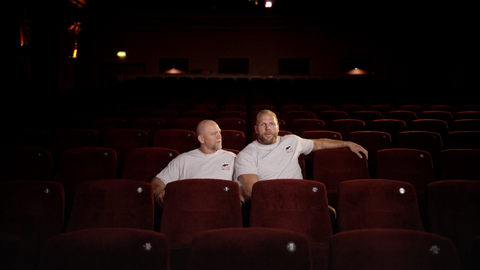 James Haskell and Mike Tindall sitting in an empty cinema sharing a can of Pringles.