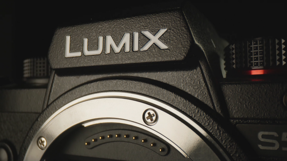 Close-up of LUMIX logo on Panasonic S5 camera.