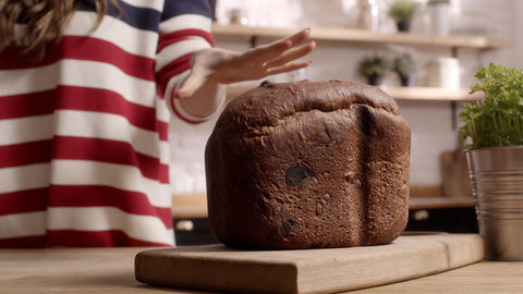 Close-up of freshly baked bread on a counter in a modern, homely kitchen.