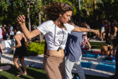 Stephi of Willfly breathwork and MSI student busting moves to the sobe drummers!