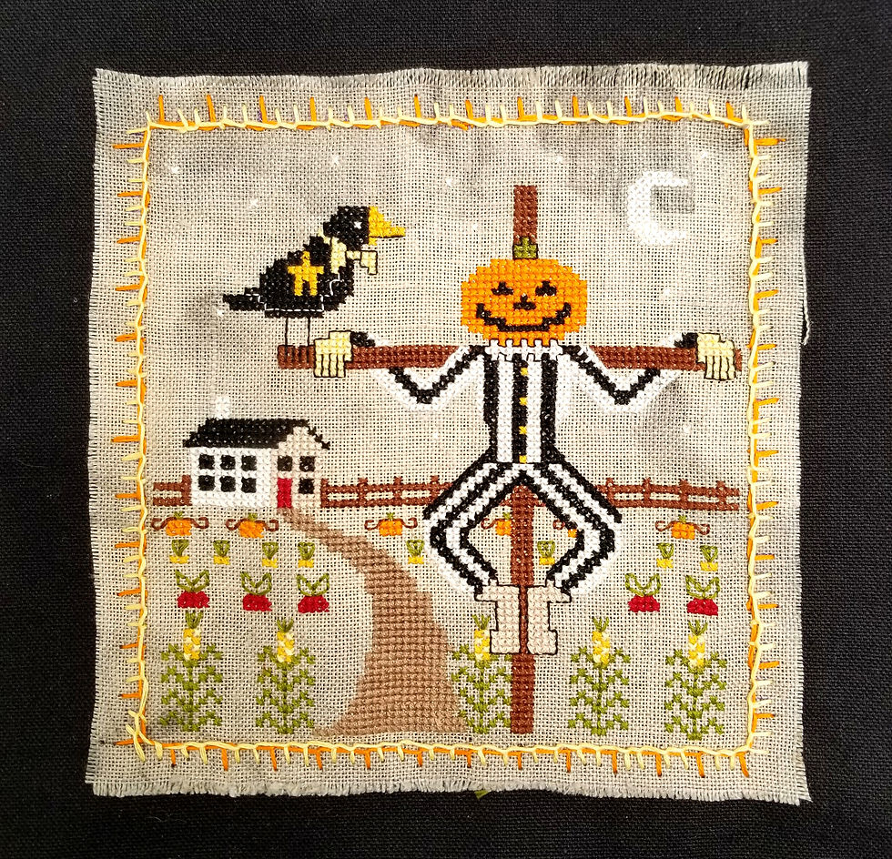 Thumbnail: A cute, rustic, fall harvest cross stitch pattern download featuring a pumpkin headed scarecrow and crow