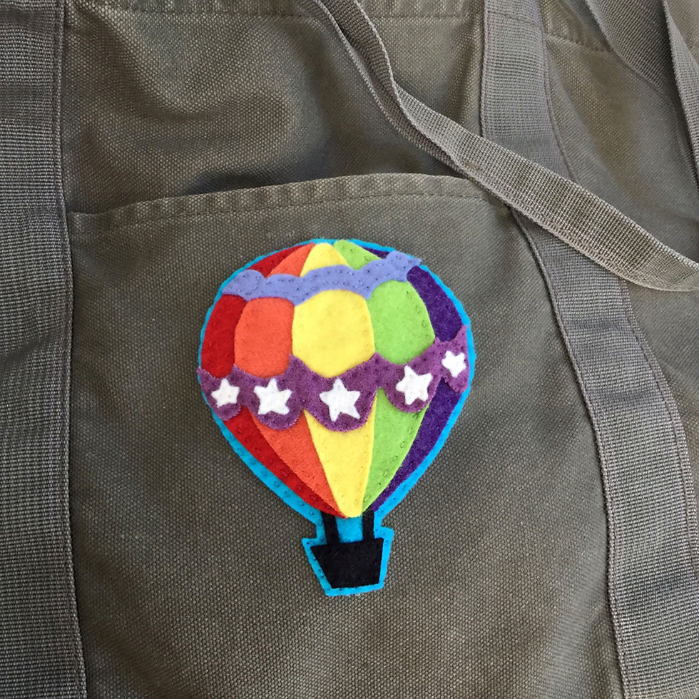 Thumbnail: Rainbow gay pride hot air balloon felt patch pattern download sewed onto a canvas bag
