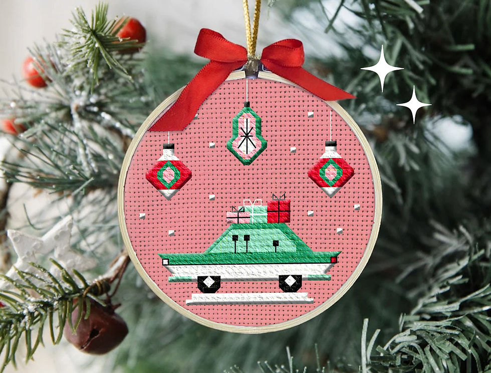 a retro mid-century modern cross stitch Christmas orament 3 inches on pink fabric