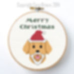 Merry Christmas free cross stitch pattern download featuring a cute puppy dog in a Santa hat