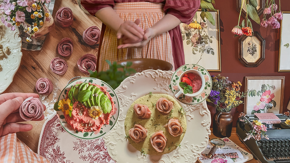 A person shapes dough into roses in a cozy kitchen. Flowers, framed art, and a typewriter decorate the warm, inviting space.