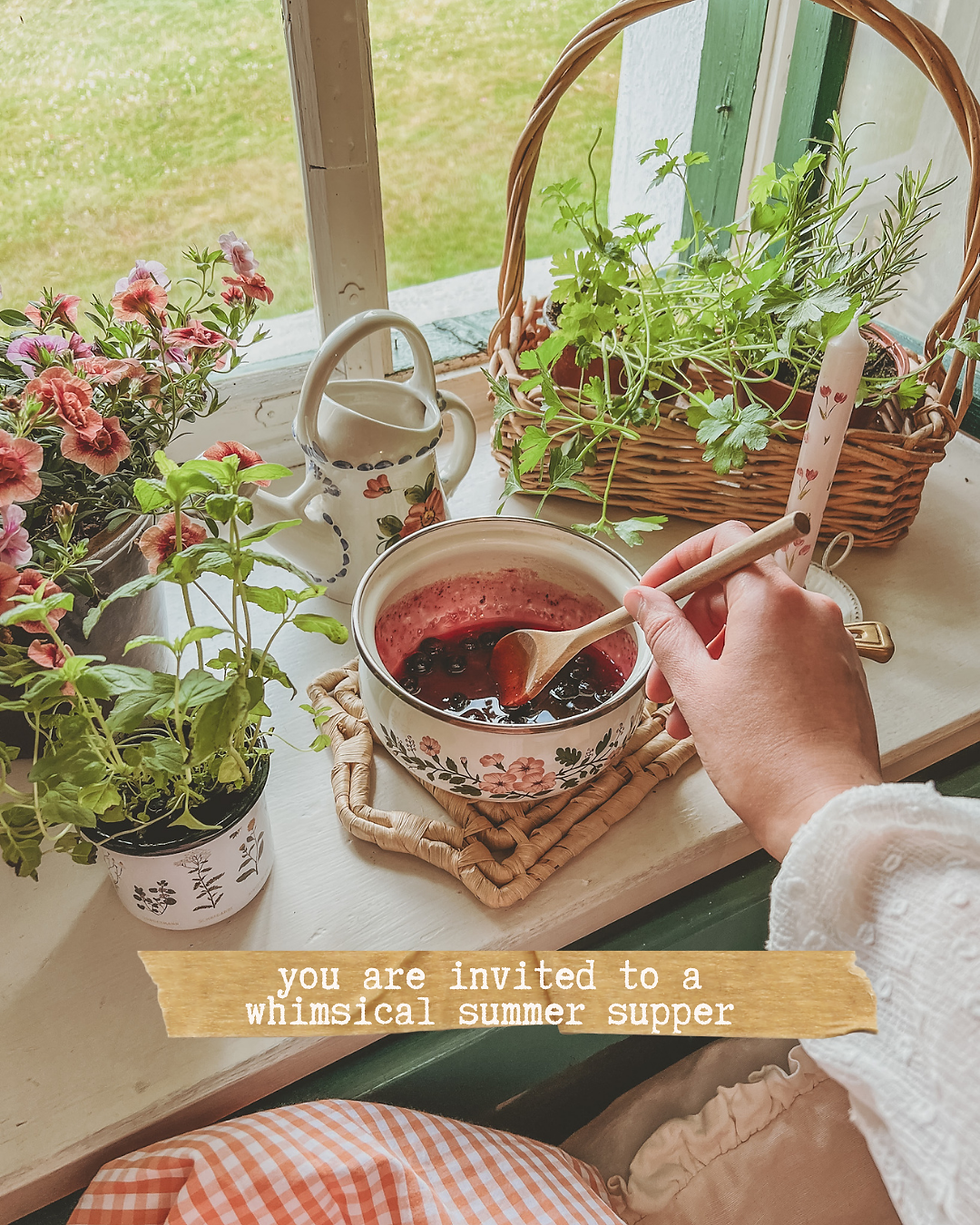 Hand stirs berry sauce in floral bowl by herb baskets and flowers on a sunny windowsill; text says whimsical summer supper