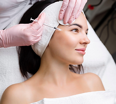 Woman getting injections in her face.