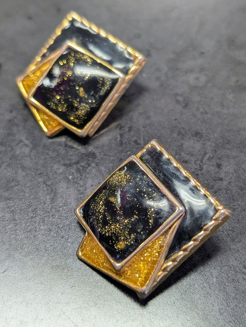 Thumbnail: 80's 90's vibe gold black geometric sparkly earrings enamel swirl