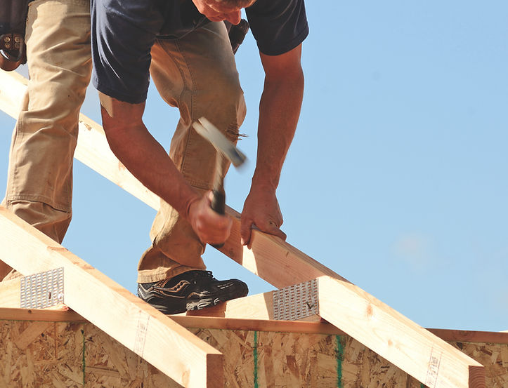 Tradespeople carrying out roof construction using quality fasteners and building products supplied by Lays Fasteners.
