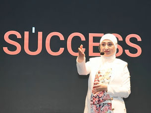 Enas Ghazal Standing on Stage