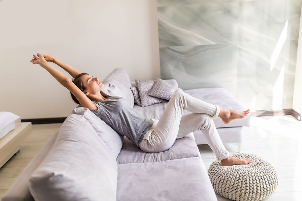 smiling-young-woman-relax-lying-couch.jpg