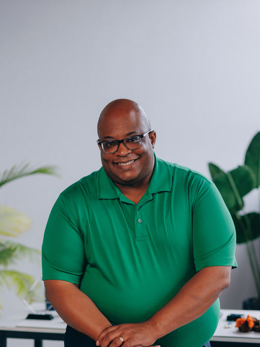 Greg Jones, founder and leader of Organizational CFO, LLC, standing confidently with a welcoming smile.