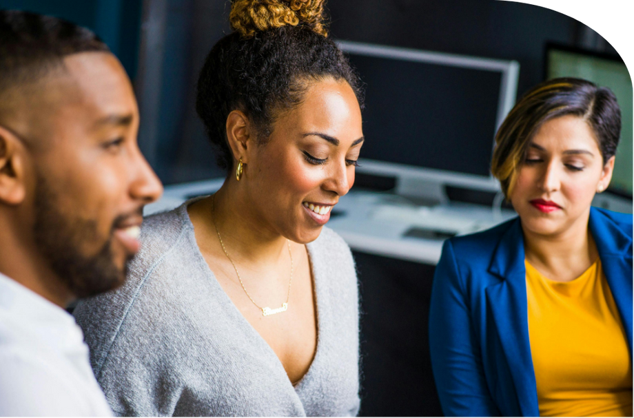 Diverse group of professionals collaborating in a modern office setting.
